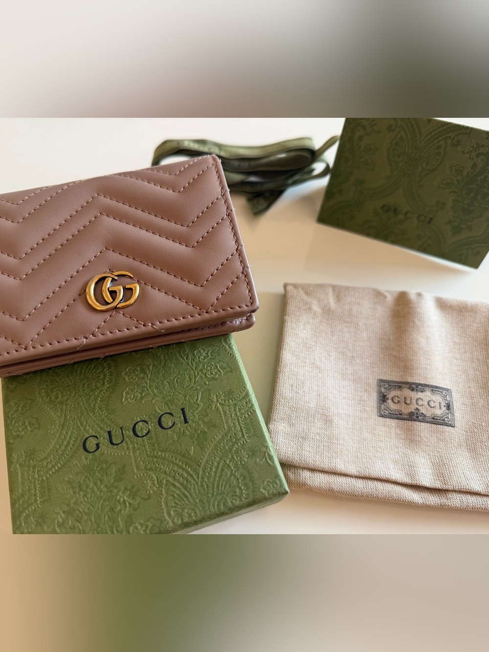 Gucci Quilted Leather GG Wallet with Gold Hardware